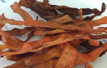 Vegan bacon is made from shaved carrots soaked in a simple marinade.