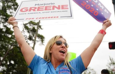 Marjorie Greene, of Milton, at the time a candidate for Congress in the sixth district, participates in a “Stop Impeachment Now” rally outside the office of Rep. Lucy McBath on Wednesday, October 9, 2019, in Sandy Springs, Georgia. Greene is a candidate in the primary election in the 14th Congressional District in Georgia. (Elijah Nouvelage/The Atlanta Journal-Constitution/TNS) 1738873 1738873