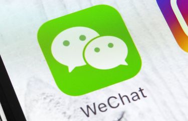 Trump signed executive actions barring business transactions with WeChat and TikTok, which could have long-reaching consequences for its many users in the U.S. (Dreamstime/TNS)  1740595 1740595