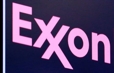 FILE – In this April 23, 2018, file photo, the logo for ExxonMobil appears above a trading post on the floor of the New York Stock Exchange.  Exxon lost $1.1 billion in the second quarter, Friday, July 31, 2020, its economic pain deepening as the pandemic kept households on lockdown, diminishing the need for oil around the world.  (AP Photo/Richard Drew, File) NYBZ234