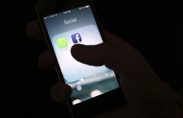 FILE – This Feb. 19, 2014, file photo shows the Facebook app icon on an iPhone in New York. Facebook is pushing back on Apple’s new privacy rules for iOS users — and putting app developers in the middle. The social network said Wednesday, Aug. 26, 2020 that anew policy by Apple that requires apps to ask users for permission to collect data on what devices they are using — and let ads follow them around on the internet — could lower the amount of money apps will make advertising through Facebook’s audience network. (AP Photo/Karly Domb Sadof, File)