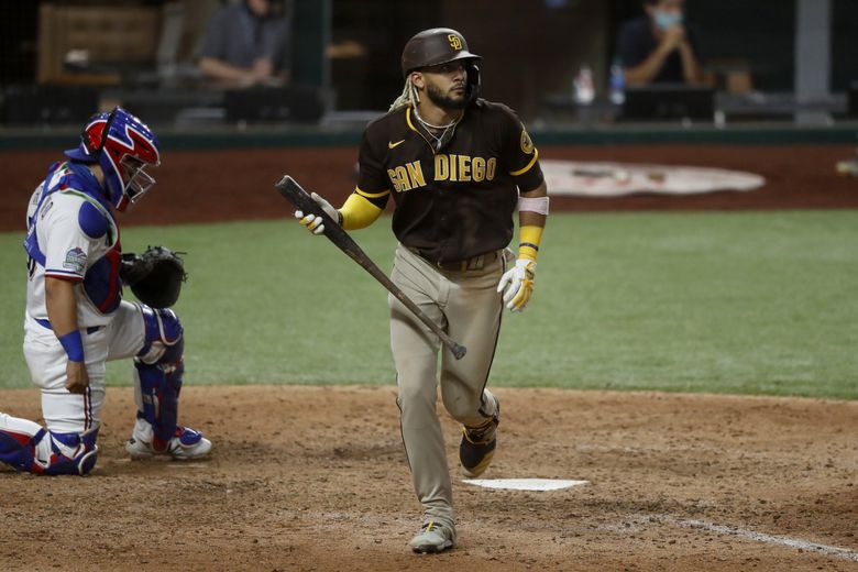 Texas Rangers catcher Jose Trevino, left, and relief pitcher Ian