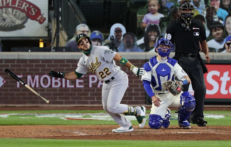 Oakland Athletics' Ramon Laureano, left, is tagged out by Houston