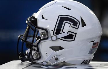 FILE – In this Sept. 7, 2019, file photo, Connecticut football helmet rests on the sideline during an NCAA college football game in East Hartford, Conn. UConn has canceled its 2020-2021 football season, becoming the first FBS program to suspend football because of the coronavirus pandemic.(AP Photo/Jessica Hill, File) NYDD203 NYDD203