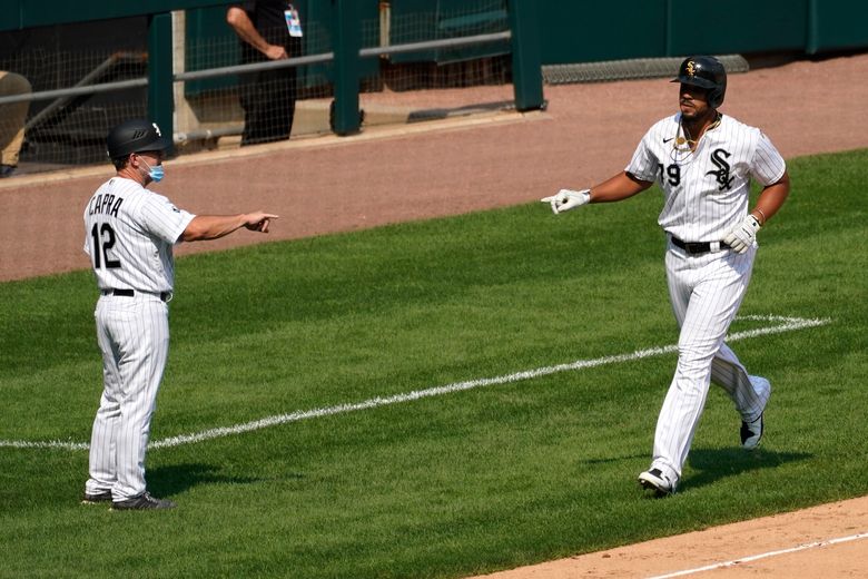 Jose Abreu and Yoan Moncada of the Chicago White Sox celebrate a win