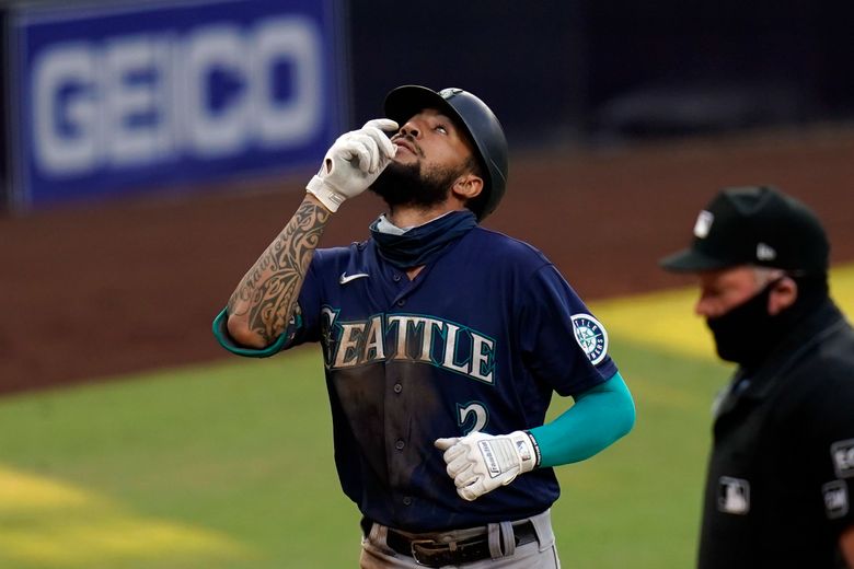 Seattle Mariners' J.P. Crawford follows through on a swing against