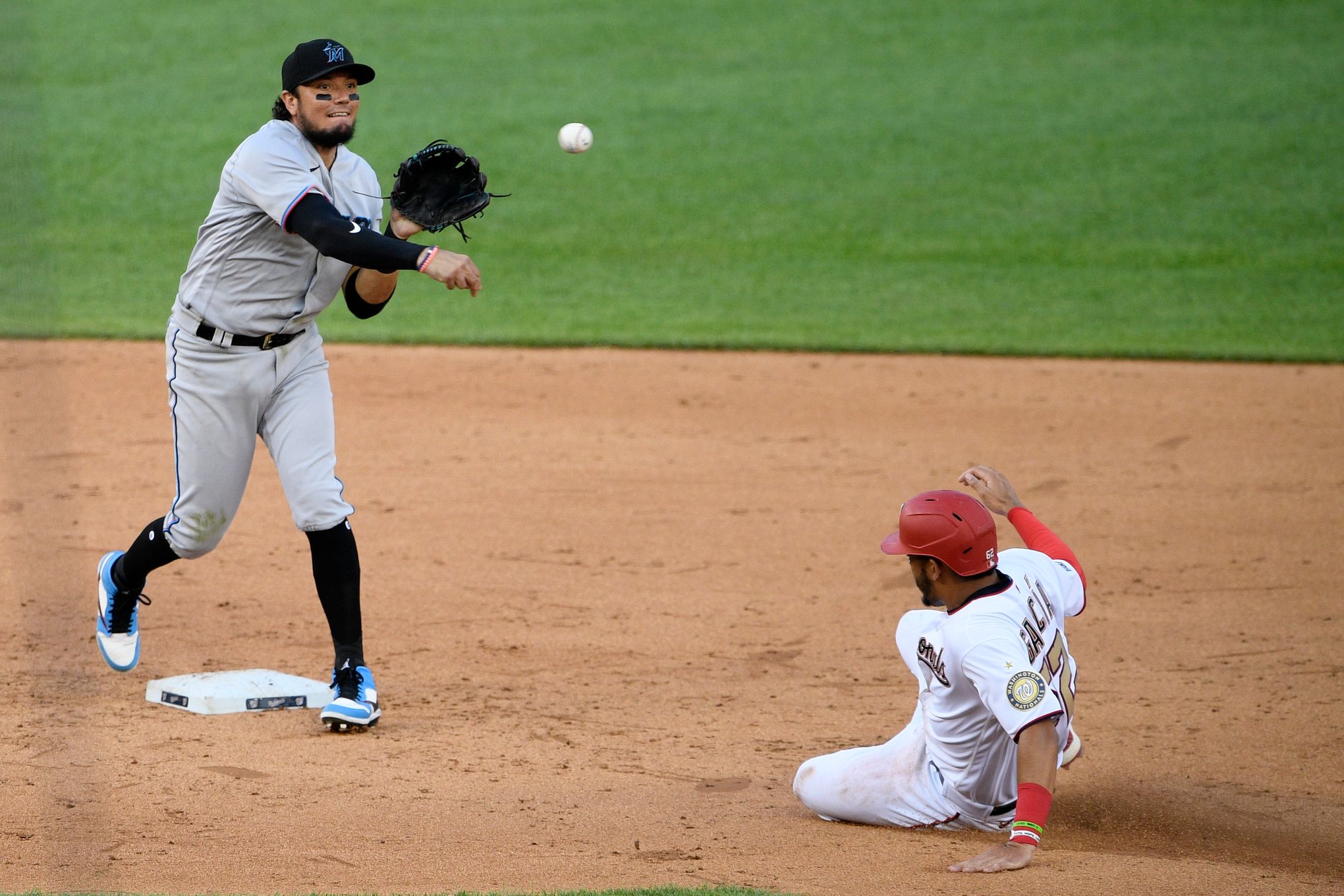 Washington Nationals shortstop Luis Garcia watches a hit during the