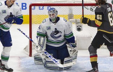 Vancouver Canucks goalie Thatcher Demko (35) reacts after giving up a gol as Vegas Golden Knights’ Mark Stone (61) celebrates while Canucks’ Tyler Myers (57) and Oscar Fantenberg (5) skate nearby during the second period of Game 5 of an NHL hockey second-round playoff series, Tuesday, Sept. 1, 2020, in Edmonton, Ontario. (Jason Franson/The Canadian Press via AP) EDM118 EDM118