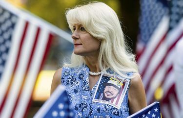A woman wears an image of Aaron J. Danielson during a memorial for him on Saturday, Sept. 5, 2020, in Vancouver, Wash. Danielson, a supporter of the conservative group Patriot Prayer, was fatally shot in August as supporters of President Donald Trump and Black Lives Matter protesters clashed in Portland, Ore. (AP Photo/Noah Berger) ORNB108 ORNB108