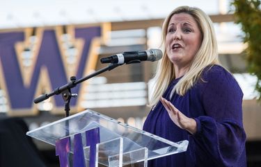 Washington Athletic Director Jen Cohen was instrumental in getting the James statue errected.  Don James’ statue was unveiled outside Husky Stadium Friday, October 27, 2017.  Hi widow, Carol, along with more than a dozen members of the extended family, former players and coaches were on hand for the event. 203923