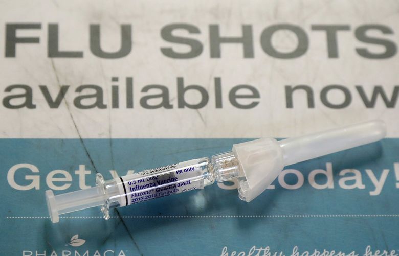 A Fluzone influenza vaccine is shown at Pharmaca Integrative Pharmacy in San Francisco, Tuesday, Jan. 9, 2018. Flu-related deaths in California are higher than usual so far this season and most victims were not vaccinated, state health officials said Tuesday in urging residents to get flu shots. (AP Photo/Jeff Chiu) CAJC102 (Jeff Chiu / AP)