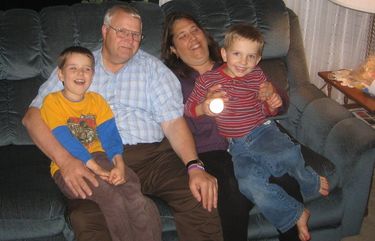 This undated photo provided by Chuck and Judy Cox shows them with their grandsons, Charlie, left, and Braden, right. Charlie and Braden were killed along with their father, Josh Powell, on Sunday in what police said was an intentional fire set by Powell. The Coxes are the parents of Powell’s wife, Susan, who has been missing since 2009. (AP Photo/Courtesy Chuck and Judy Cox) SE101