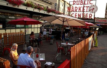 People dine at Radiator Whiskey, front, and Matt’s in the Market, behind, at Pike Place Market’s “Pop-up patio on the cobblestones” in Seattle Thursday, Sept. 10, 2020. For more information Pike Place’s patios, rooftop bars and street-side dining, visit: http://pikeplacemarket.org/blog/outdoor-dining-pike-place-market
*Editors note: Couple is fine with image, just didn’t want to include names. 215043