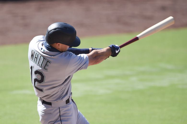 Seattle Mariners’ Evan White hits a single during the fifth inning of a baseball game against the San Diego Padres Sunday, Sept. 20, 2020, in San Diego.  (Denis Poroy / The Associated Press)