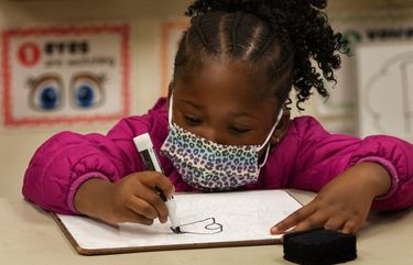 Mamieyah Konneh, 5, a kindergartner at the Birch Creek Youth Center, colors during one of her classes at the center Wednesday, September 23, 2020.

She is attending a learning hub set up by the King County Housing Authority to help kids enrolled in online school as a group.

This is the same idea as a pandemic pod — well-off families setting up learning groups in their homes — but it’s run by a service agency and is for kids whose families can’t afford a private tutor.  215073