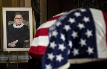 The flag-draped casket of Justice Ruth Bader Ginsburg lies in state in the U.S. Capitol on Friday, Sept. 25, 2020. Ginsburg died at the age of 87 on Sept. 18 and is the first women to lie in state at the Capitol. (Erin Schaff/The New York Times via AP, Pool) WX265 WX265