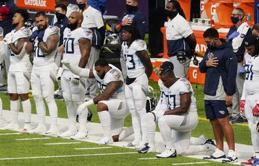 Members of the Tennessee Titans take part in the national anthem before an NFL football game against the Minnesota Vikings, Sunday, Sept. 27, 2020, in Minneapolis. The NFL says the Tennessee Titans and Minnesota Vikings are suspending in-person activities after the Titans had three players test positive for the coronavirus, along with five other personnel. The league says both clubs are working closely with the NFL and the playersâ€™ union on tracing contacts, more testing and monitoring developments. The Titans are scheduled to host the Pittsburgh Steelers on Sunday.(AP Photo/Jim Mone) NY152 NY152