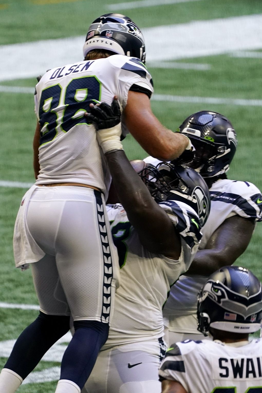 Seahawks tight end Greg Olsen celebrates his touchdown in the end zone against the Falcons on Sunday in Atlanta. (Brynn Anderson / The Associated Press)