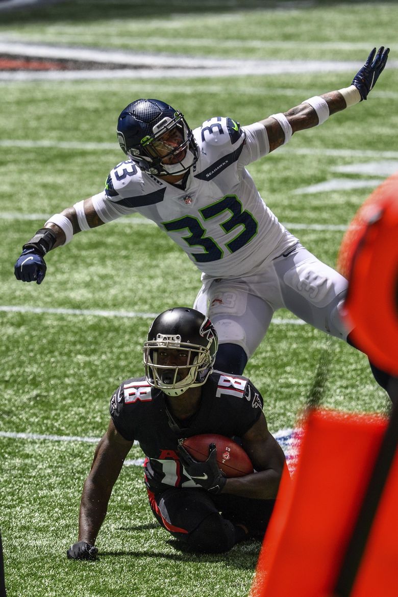 Wilson throws 4 TD passes, Seahawks beat Falcons 38-25