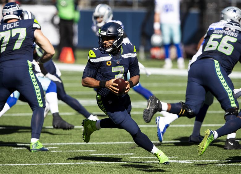 Seattle Seahawks running back Chris Carson gestures while smiling after an  NFL football game against the Dallas Cowboys, Sunday, Sept. 27, 2020, in  Seattle. The Seahawks won 38-31. (AP Photo/Stephen Brashear Stock