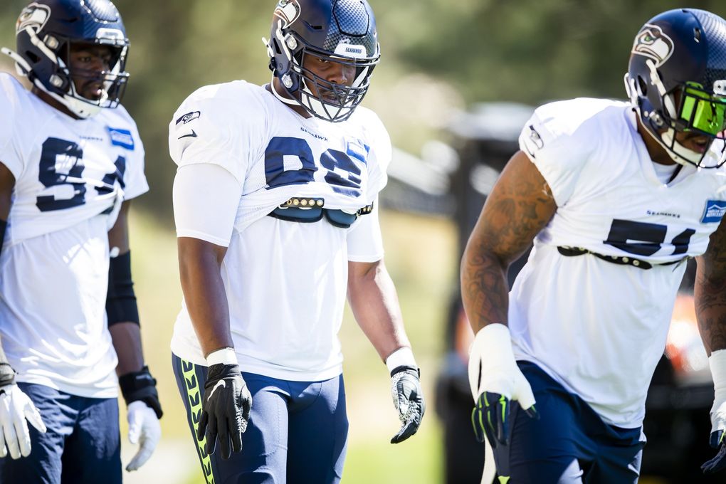 Seahawks defensive end Alton Robinson lines up for drills at the Virginia Mason Athletic Center for training camp Aug. 30. (Bettina Hansen / The Seattle Times)
