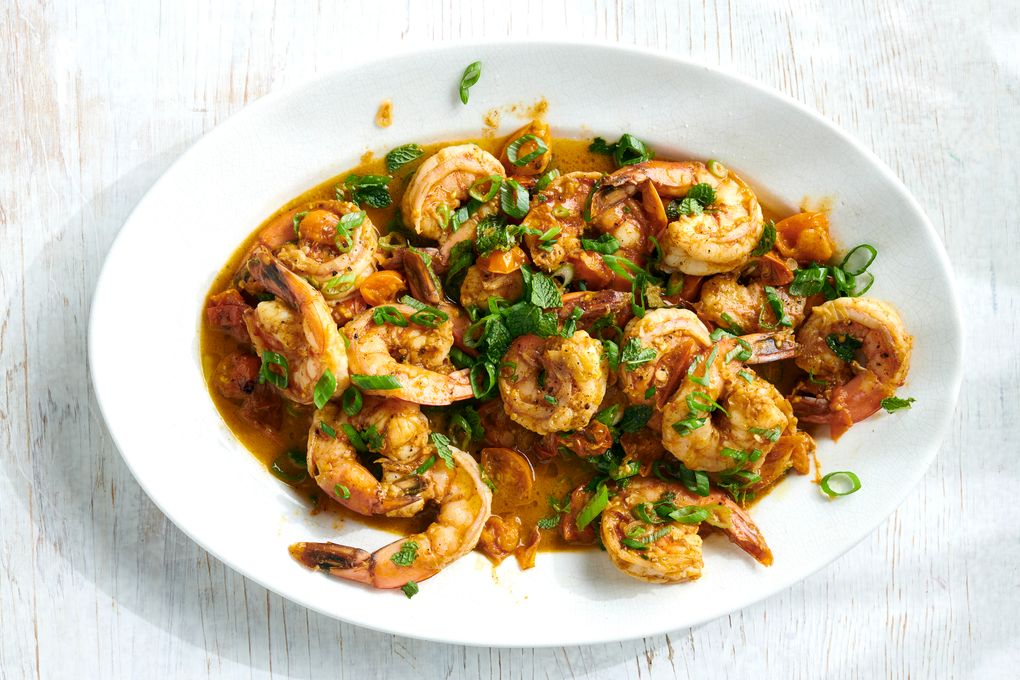 Spiced ginger shrimp with burst tomatoes, Sept. 2, 2020. Adding a handful of tomatoes to this take on shrimp scampi makes for a bright, full-flavored meal that’s speedy and complex. Food styled by Simon Andrews. (David Malosh/The New York Times)