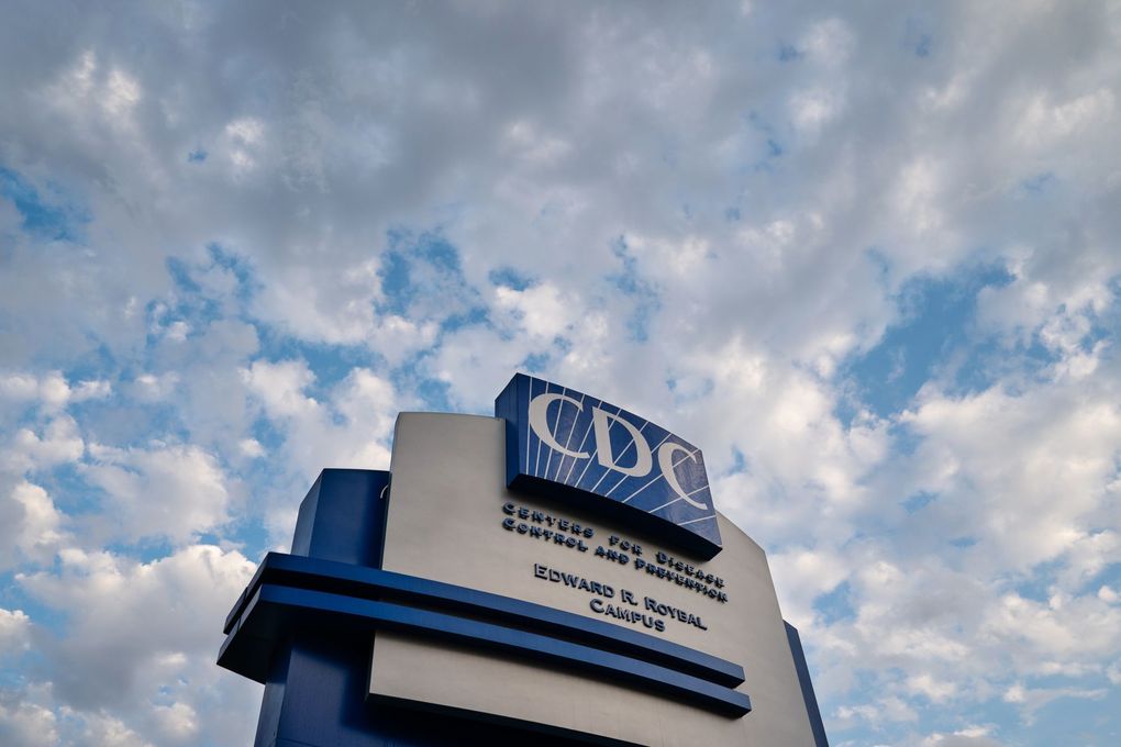 Signage stands outside the Centers for Disease Control and Prevention (CDC) headquarters in Atlanta, Georgia, U.S, on Saturday, March 14, 2020. U.S. health officials Wednesday redefined what counts as close contact with someone with COVID-19 to include briefer but repeated encounters. Photographer: Elijah Nouvelage/Bloomberg (Bloomberg)