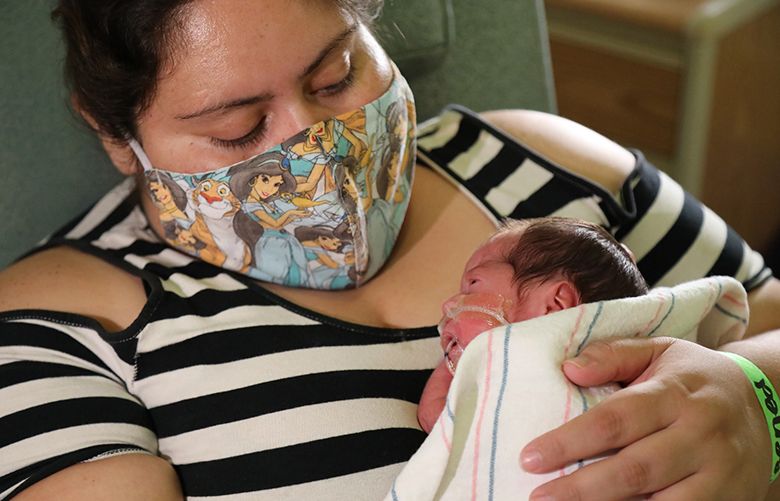 Blanca Rodriguez holds Jade in the intensive care unit of Loma Linda University Health in Loma Linda, Calif. (Loma Linda University Children’s Health).