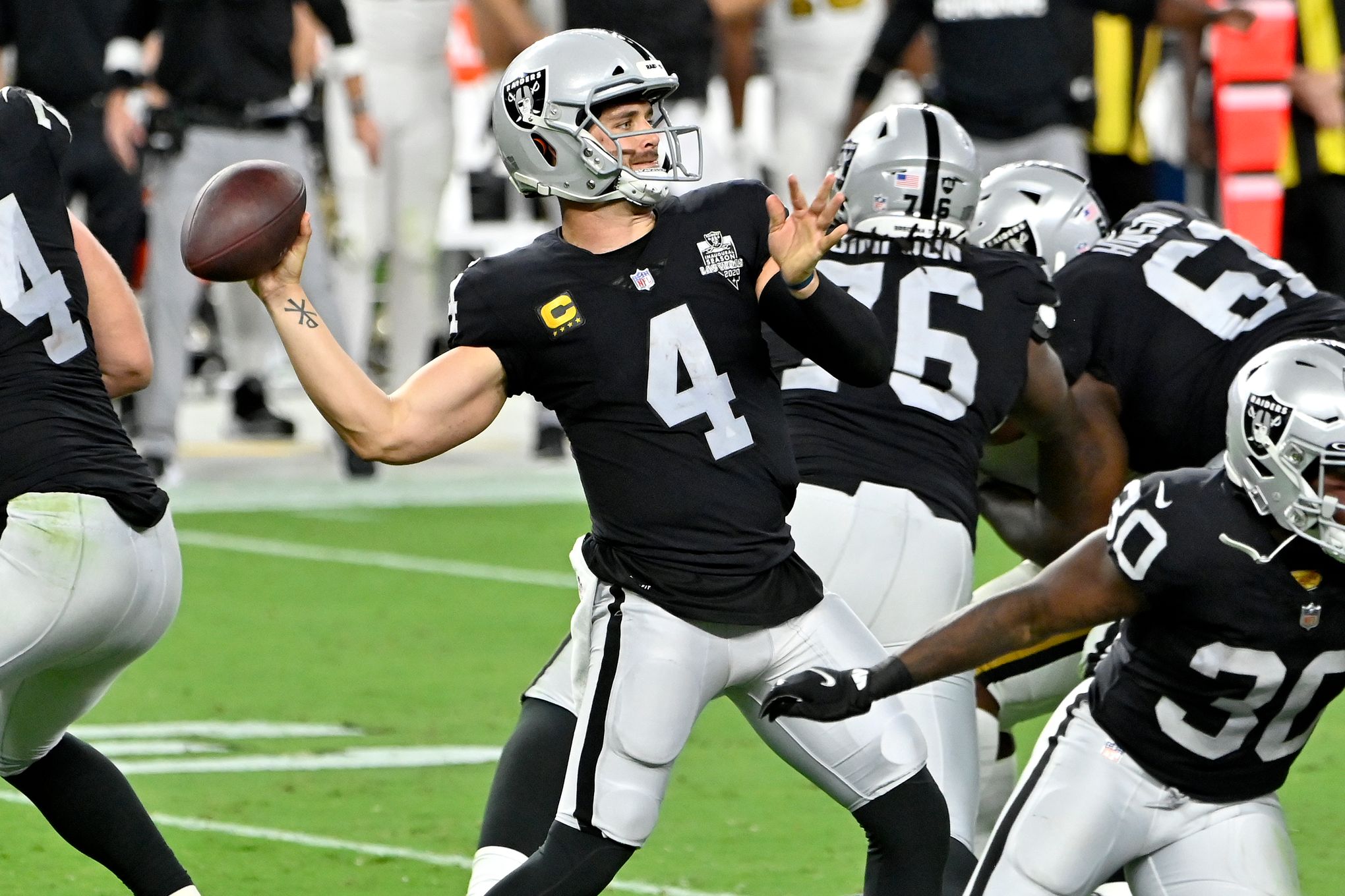 Oakland Raiders quarterback Derek Carr l passes against the Seattle  Seahawks during the second quarter at CenturyLink Field in Seattle,  Washington on November 2, 2014. Carr passed for 194 yards, two touchdown