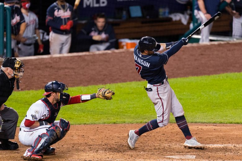 Huascar Ynoa and Tyler Flowers of the Atlanta Braves walk toward