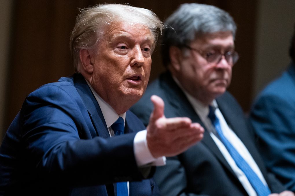 Attorney General William Barr listens as President Donald Trump speaks during a meeting with Republican state attorneys general in the White House, Sept. 23, 2020. (AP Photo / Evan Vucci, File)