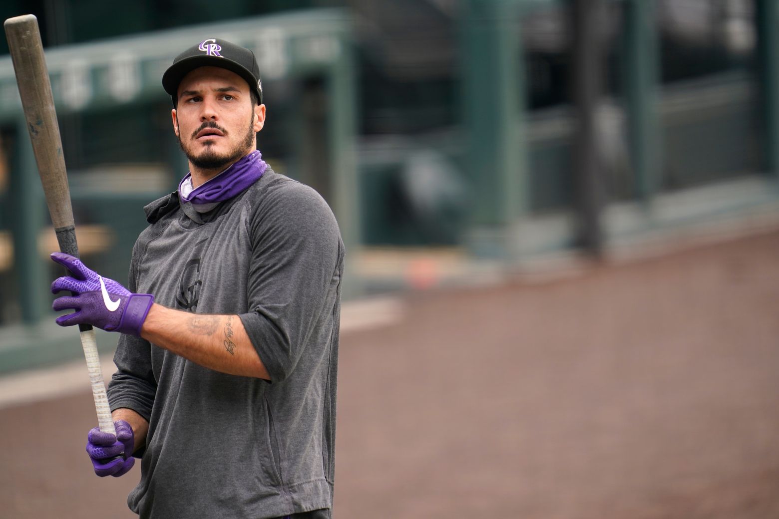 Rockies' Nolan Arenado, dealing with sore left shoulder, sits