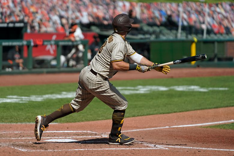 San Diego Padres' Manny Machado looks on as he runs to first base during  the seventh inning of a baseball game against the San Francisco Giants  Friday, March 29, 2019, in San