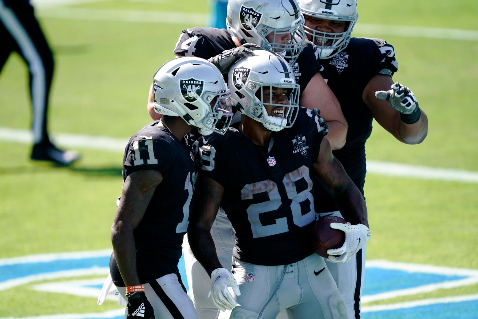 Las Vegas Raiders strong safety Johnathan Abram (24) sprints out onto the  field before the star …