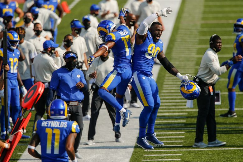 Robert Woods of the Los Angeles Rams rushes against John