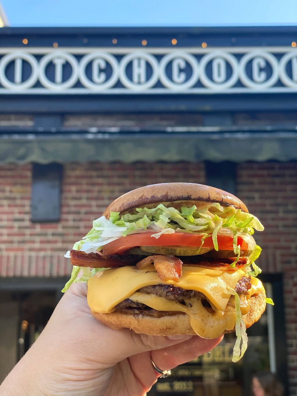 Brendan McGill’s Hitchcock Deli has added smash burgers to the menu, complete with melty American cheese. (Courtesy of Hitchcock Deli)