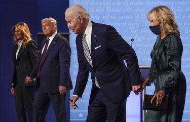 First lady Melania Trump, from left, President Donald Trump, Democratic presidential candidate former Vice President Joe Biden and Jill Biden stand on stage after the first presidential debate at Case Western University and Cleveland Clinic, in Cleveland, Ohio, Sept. 29, 2020. (AP Photo/Julio Cortez)