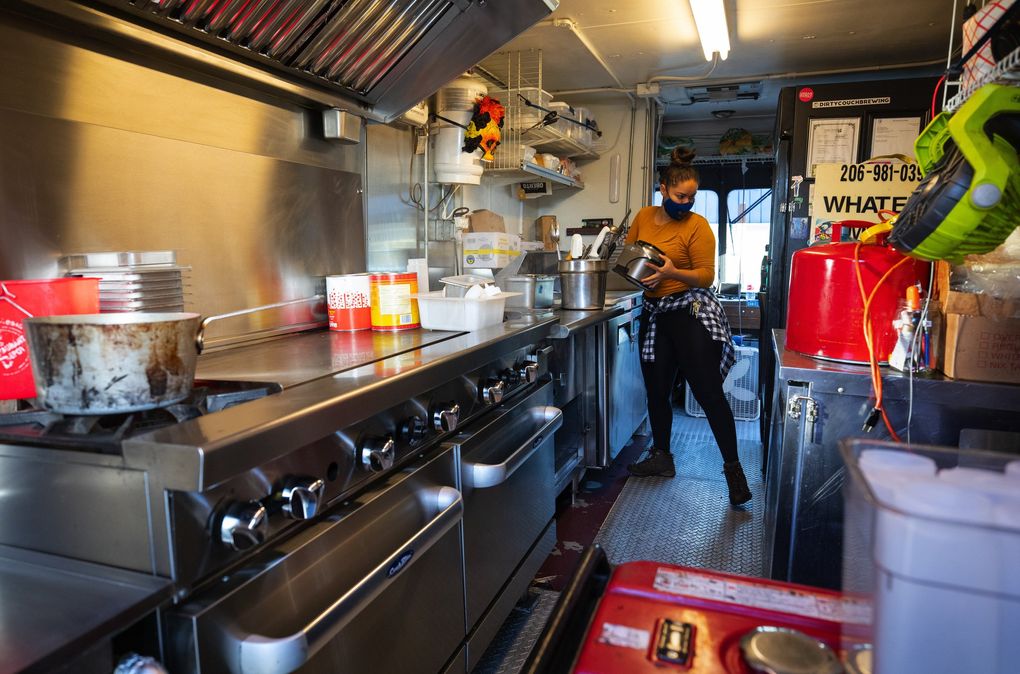Yamel Tellez, manager of the Whateke food truck, goes through the truck’s kitchen prep routine at Chop Kitchens in White Center on Oct. 8, 2020. (Ellen M. Banner / The Seattle Times)