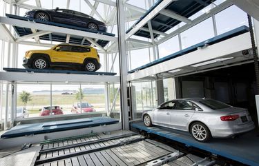 A vehicle is moved onto the retrieval platform at the Carvana Co. car vending machine in Frisco, Texas, U.S., on Thursday, June 8, 2017. The U.S. automotive industry may be struggling with an array of concerns ranging from sliding used-car prices to rising inventories, but they do not faze the co-founder and chief executive officer of Carvana Co., an online dealer for used cars. Photographer: Laura Buckman/Bloomberg