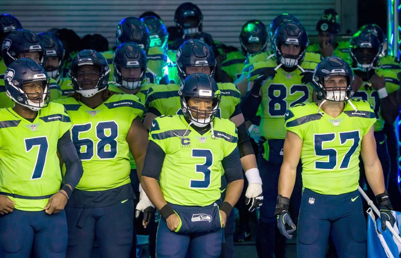 Seahawks quarterback Russell Wilson and teammates line up in the tunnel to take on the Minnesota Vikings at CenturyLink Field on October 11. (Bettina Hansen / The Seattle Times)