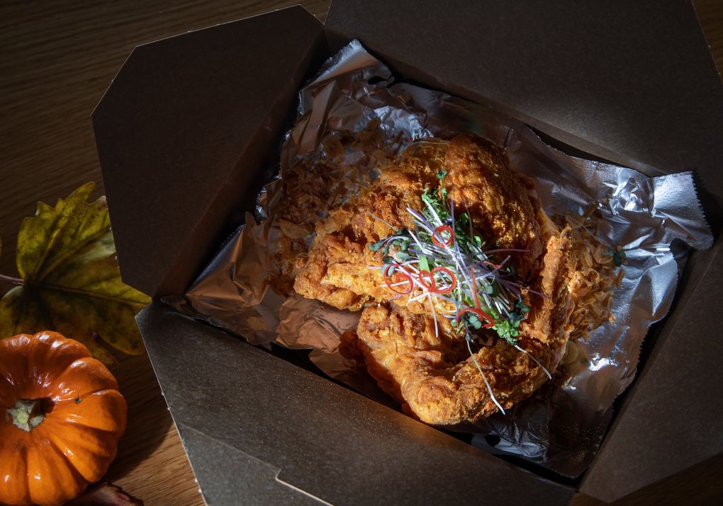 Di Fiora’s Korat chicken wings have a coating so incredibly crispy that taking them to-go is no problem. They might be the city’s best wings — and they’re huge and organic, too. (Ellen M. Banner / The Seattle Times)