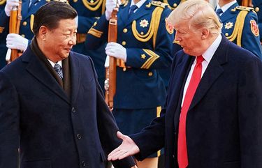 From left, China’s President Xi Jinping and U.S. President Donald Trump shake hands on Nov. 9, 2017, during a meeting outside the Great Hall of the People in Beijing. (Artyom Ivanov/Tass/Abaca Press/TNS) 1800377 1800377
