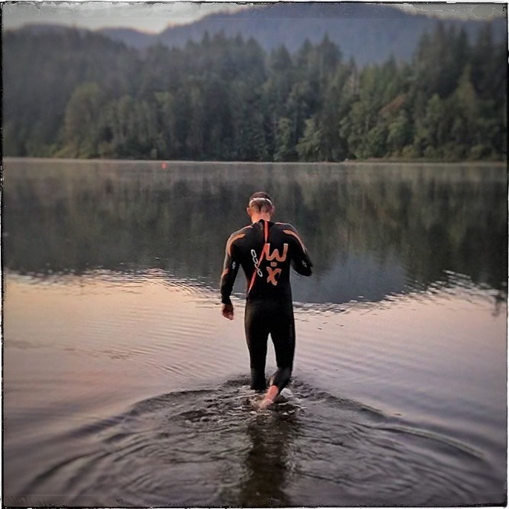 Jimmy Watts descends into Lake Padden in Bellingham to begin his “Solo Man” triathlon on Sept. 6. (Photo courtesy Jimmy Watts / )