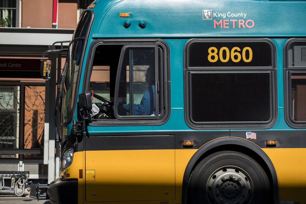 A metro bus rolls through downtown Seattle this spring. (Amanda Snyder / The Seattle Times)