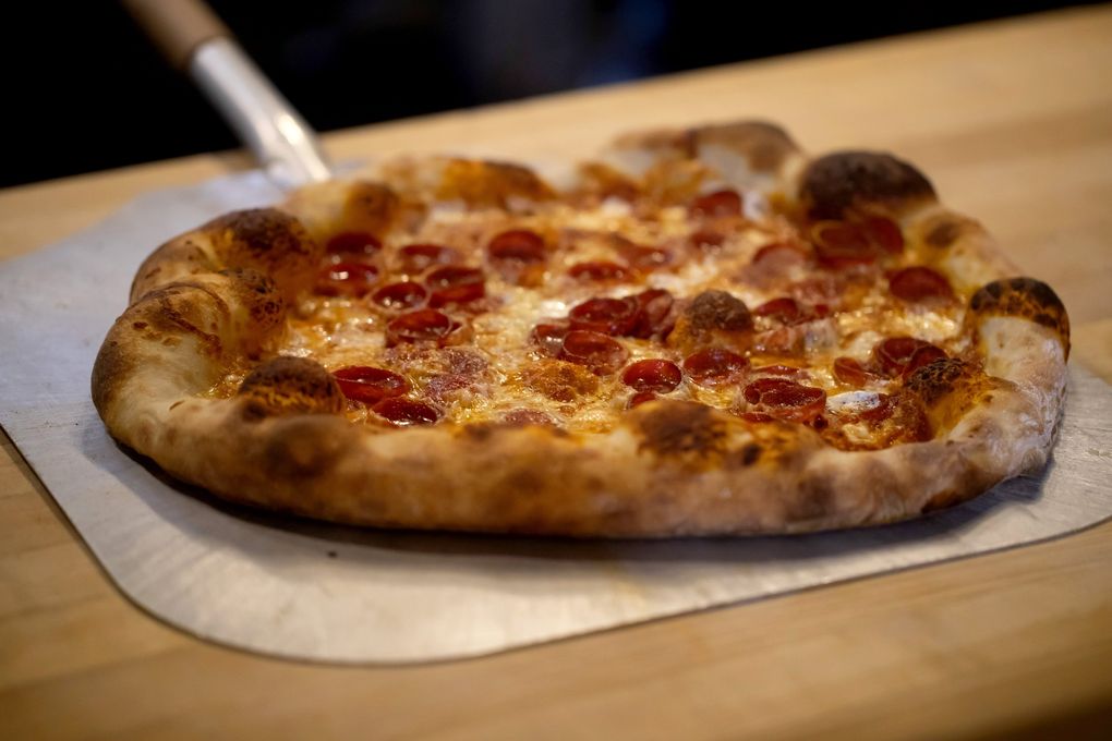 A pizza from Dantini Pizza is photographed at Harry’s Fine Foods on Capitol Hill, Oct. 20, 2020. (Erika Schultz / The Seattle Times)