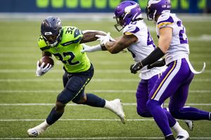 Dallas Cowboys' Nahshon Wright (25) defends as safety Markquese Bell (41)  gains yards after intercdepting a Seattle Seahawks pass in the second half  of a preseason NFL football game in Arlington, Texas