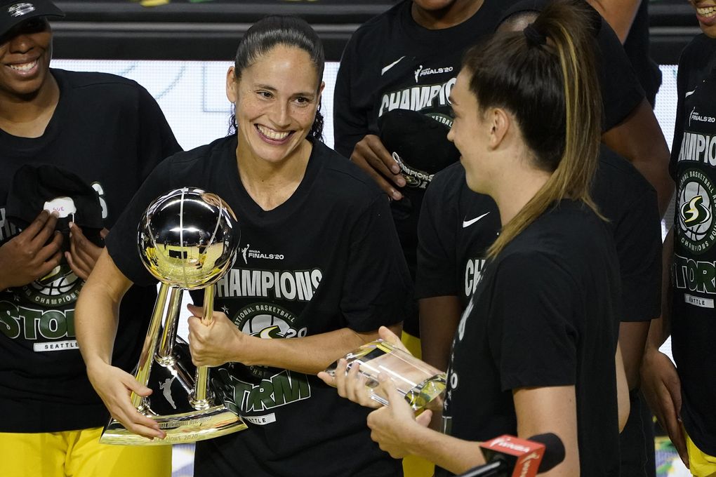 Seattle Storm guard Sue Bird, left, smiles at Breanna Stewart after the team defeated the Las Vegas Aces to win basketball’s WNBA Championship Tuesday, Oct. 6, 2020, in Bradenton, Fla. (AP Photo / Chris O’Meara)