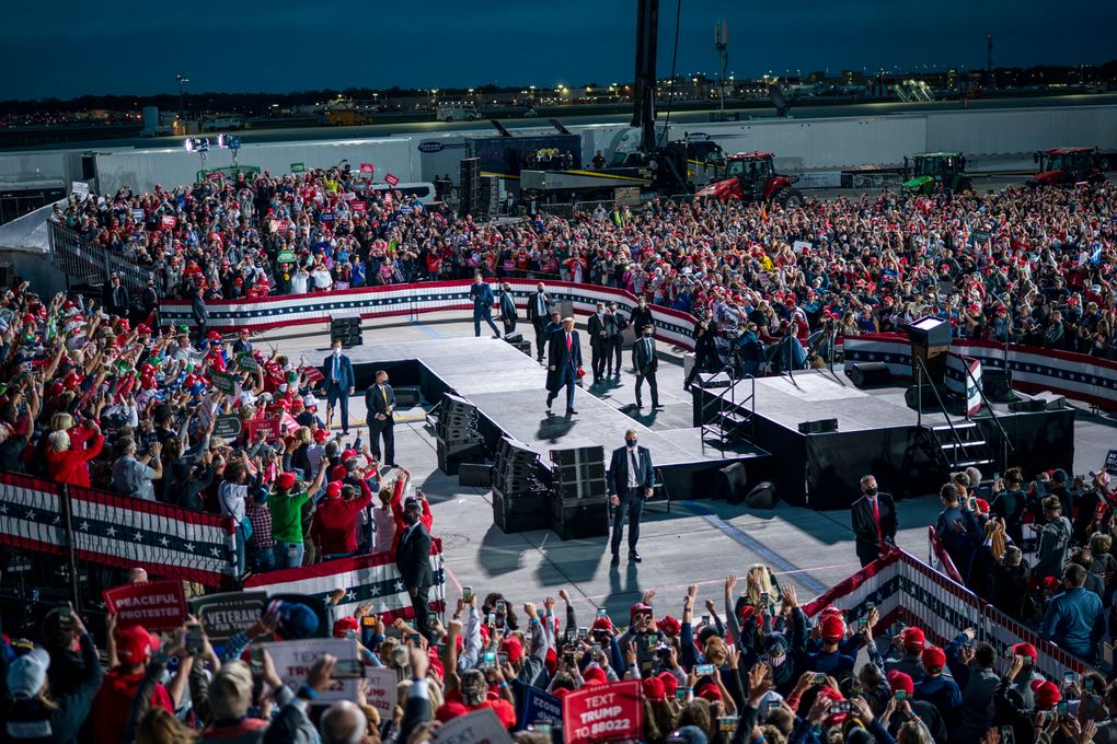 President Donald Trump appears at a campaign rally in Des Moines on Oct. 14, 2020. Gov. Kim Reynolds of Iowa is not on the ballot in November, but her refusal to issue mask mandates and flouting of guidance from infectious disease experts as her state sees a grim tide of new cases and deaths may be hurting the campaigns of fellow Republicans. (Doug Mills/The New York Times)