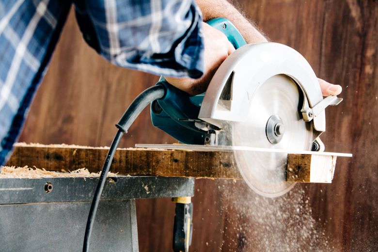A circular saw is a lightweight and versatile tool that can cut through large panels, rip lumber or make notches in boards with its adjustable blade. (iStock)