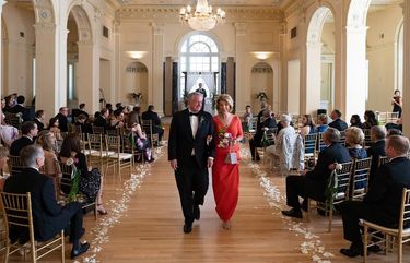 In this photo provided by Ember Studio, White House Chief of Staff Mark Meadows and his wife, Debbie Meadows, walk down the aisle at their daughter’s wedding, Sunday, May 31, 2020, in Atlanta. (Courtesy of Ember Studio via AP) NYSB411 NYSB411
